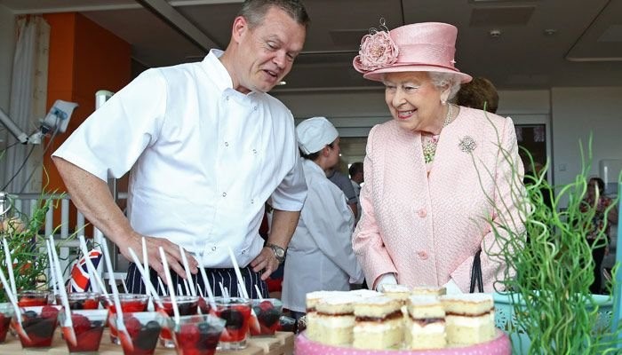Queen and chef enjoying the Royal tea party
