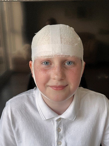 An image of a patient with their head bandaged