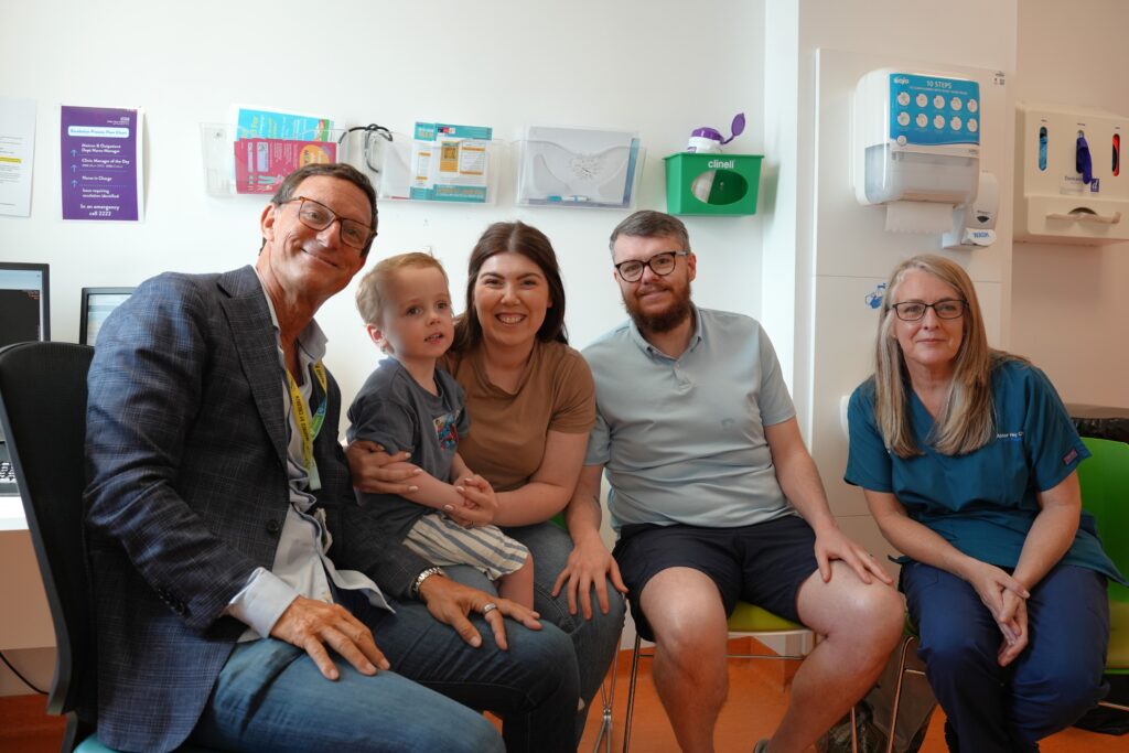 A picture of Conor with his parents and the team that treated him at Alder Hey