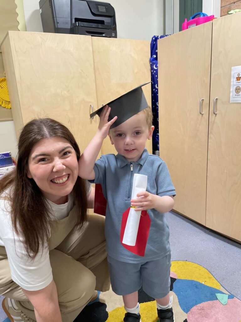 Conor with his mum graduating nursery