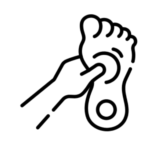 An image showing a hand massaging a foot to depict reflexology.