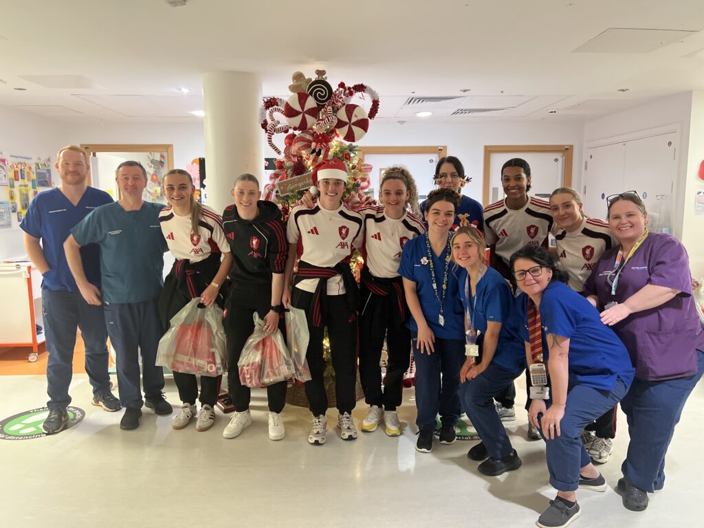 LFC Ladies players with an Alder Hey staff on a hospital ward