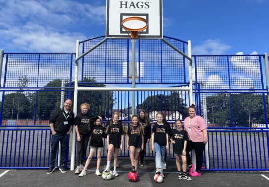 Alder Hey Youth Forum members play on the multi use games area on Springfield Park