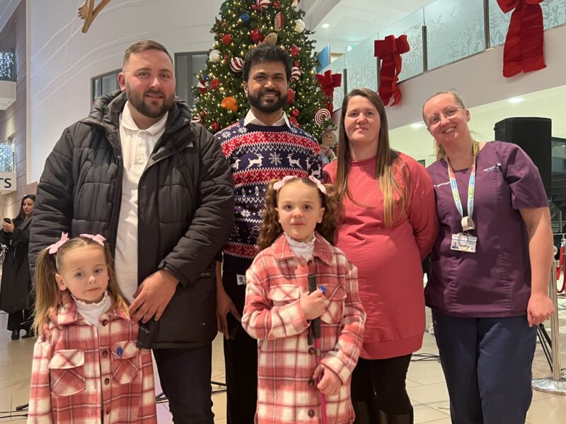 Dr Senthil and Alder Hey nurse pose for picture with patient Rubi-Mae and family