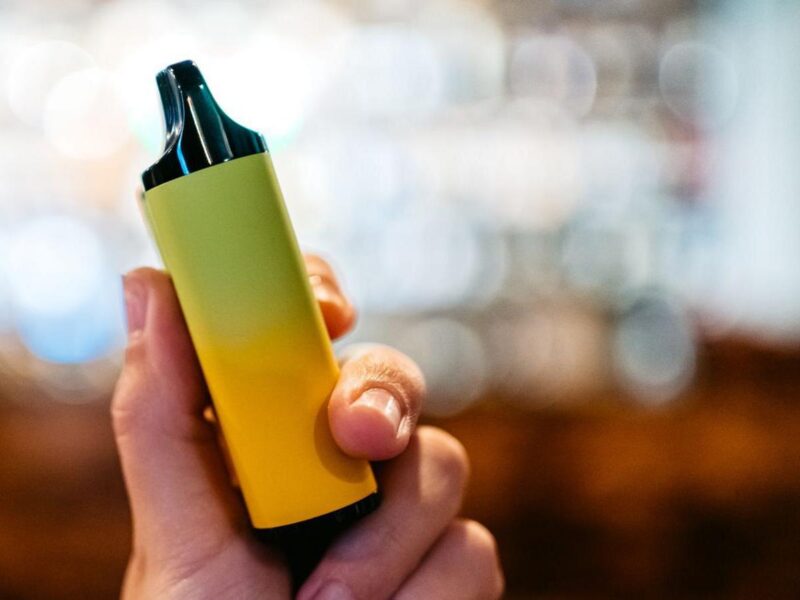 hand holding a vape