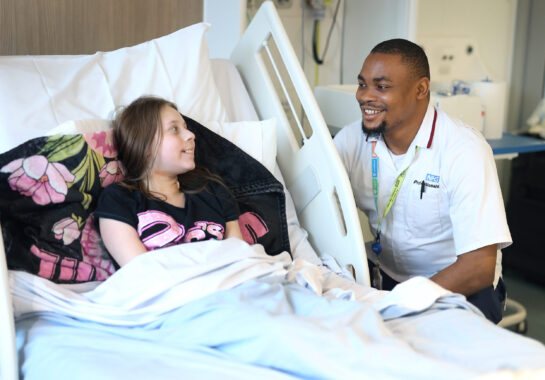 Image of nurse and patient smiling