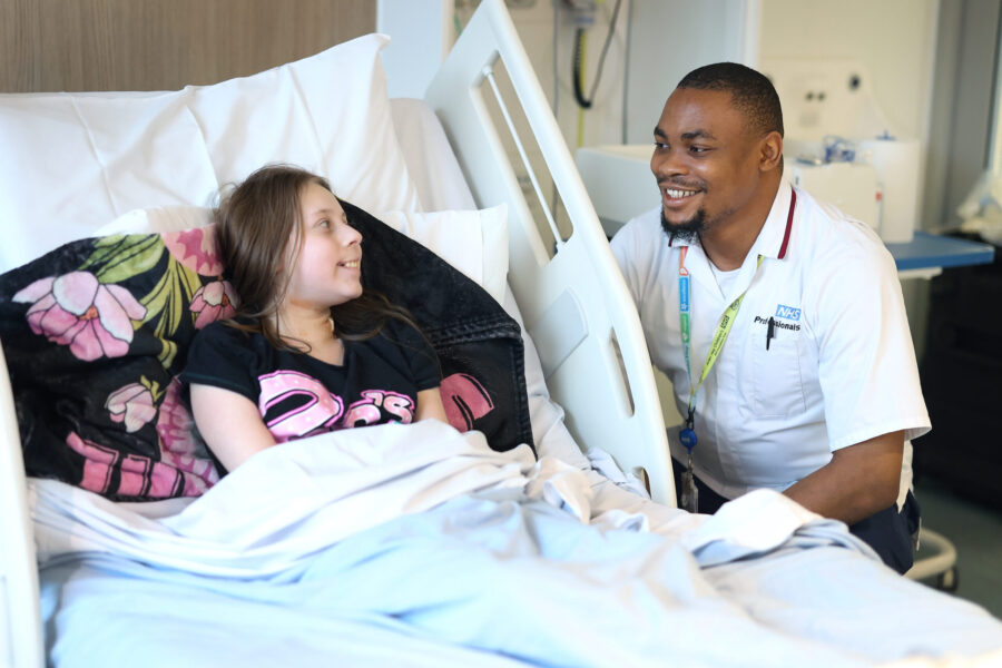 Image of nurse and patient smiling