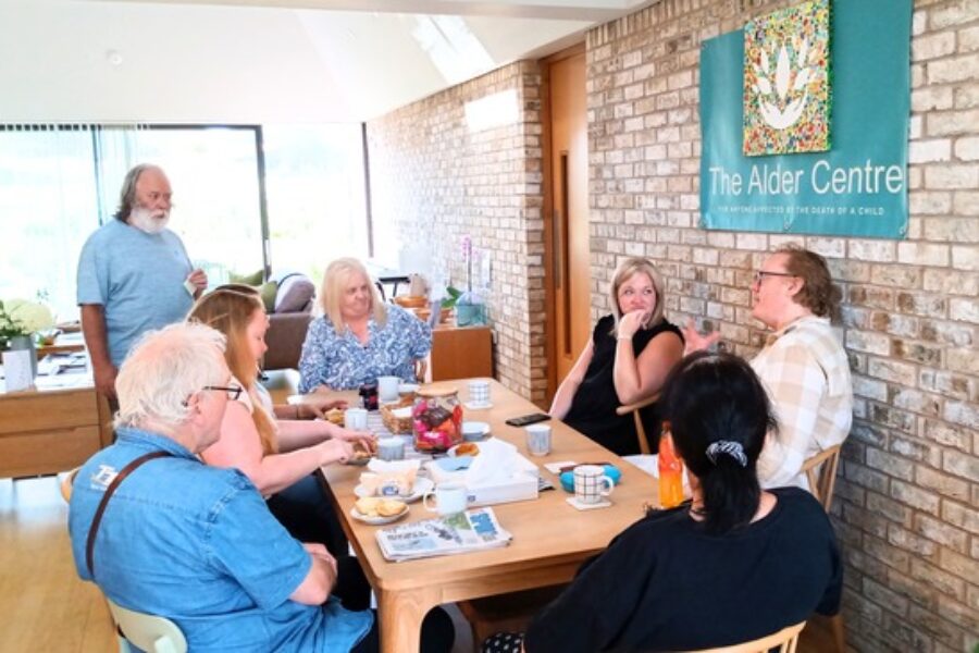 An image of people sitting around a table chatting