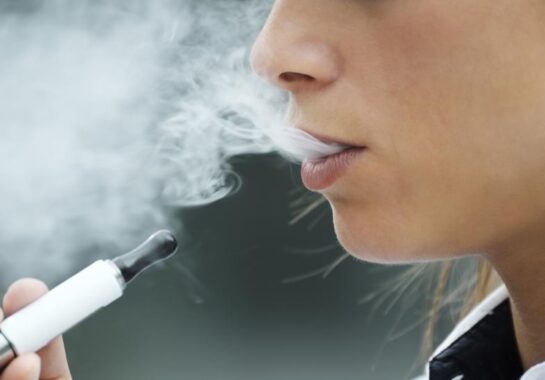 A person smoking a vape.