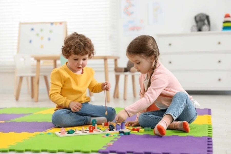 A stock image of young children playing with toys.