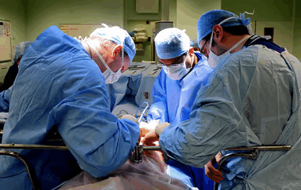 An image of surgeons in a operating theatre.