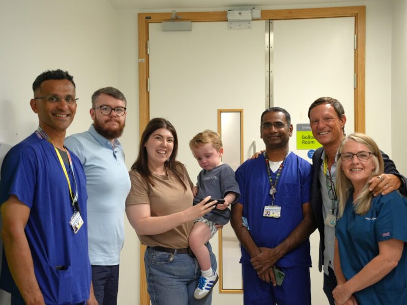 A picture of Conor with his parents and the team that treated him at Alder Hey