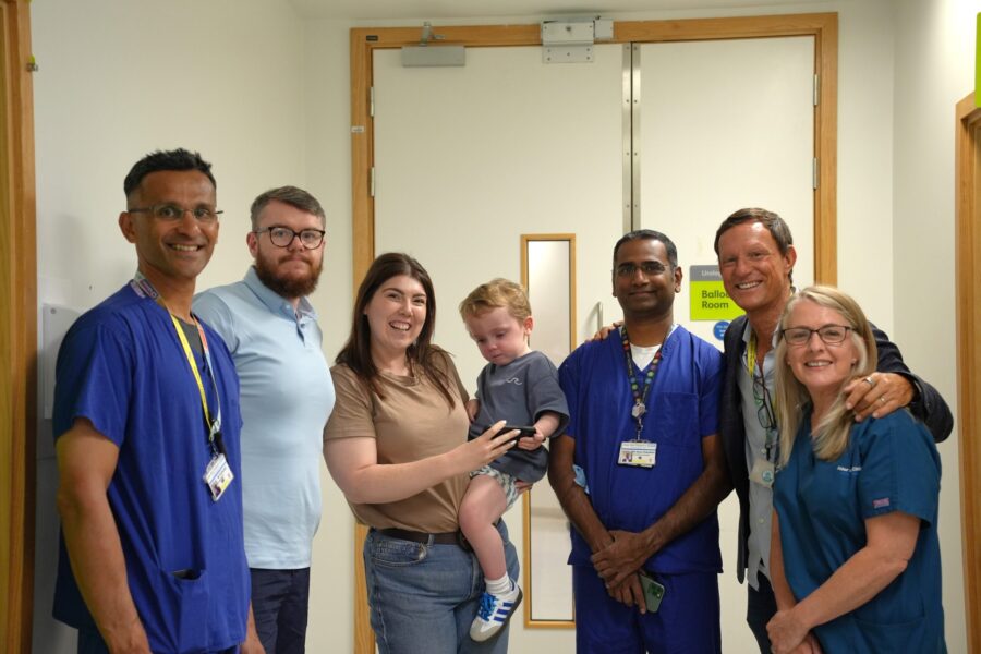 A picture of Conor with his parents and the team that treated him at Alder Hey