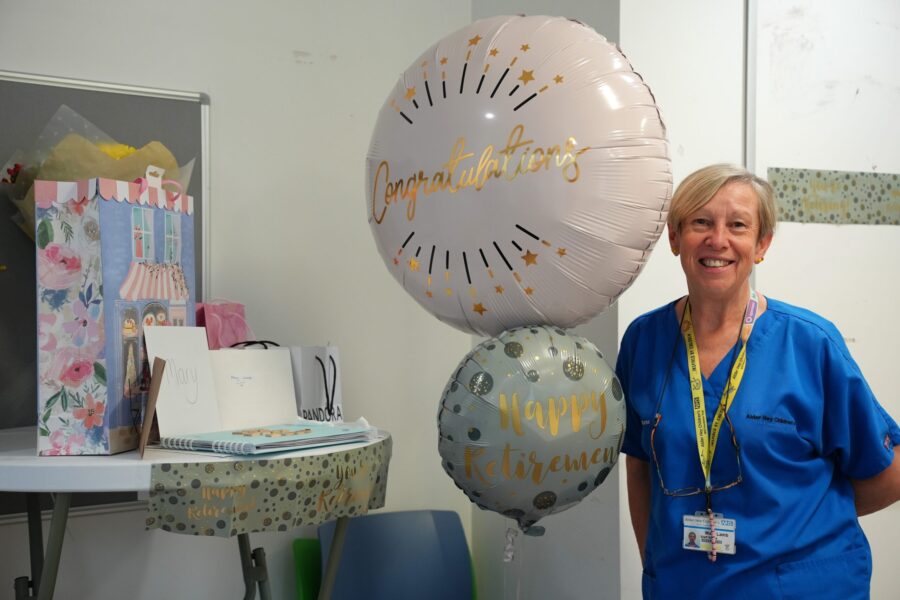 Mary Lamb pictured with a balloon celebrating her retirement at Alder Hey
