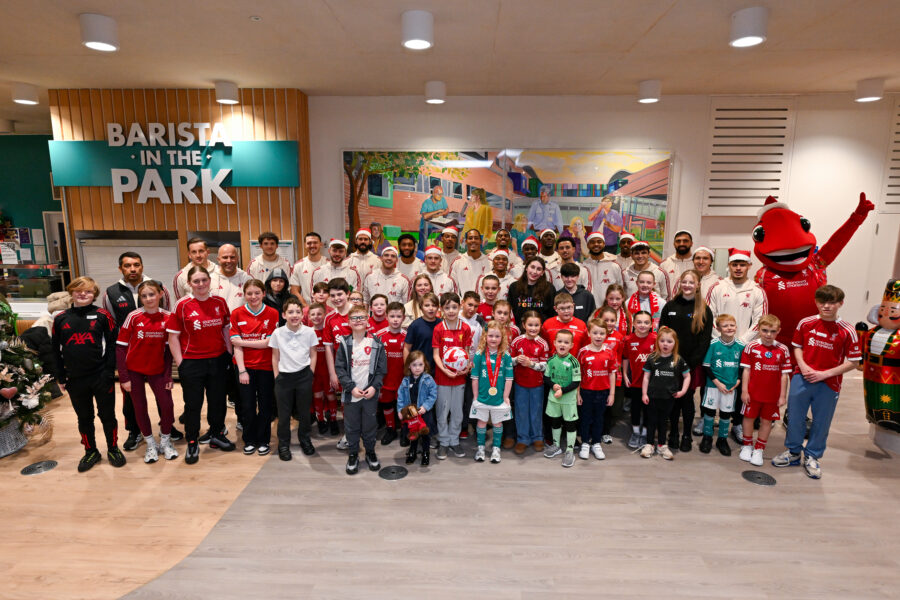 The Liverpool FC squad lined up for a photo with Alder Hey patients