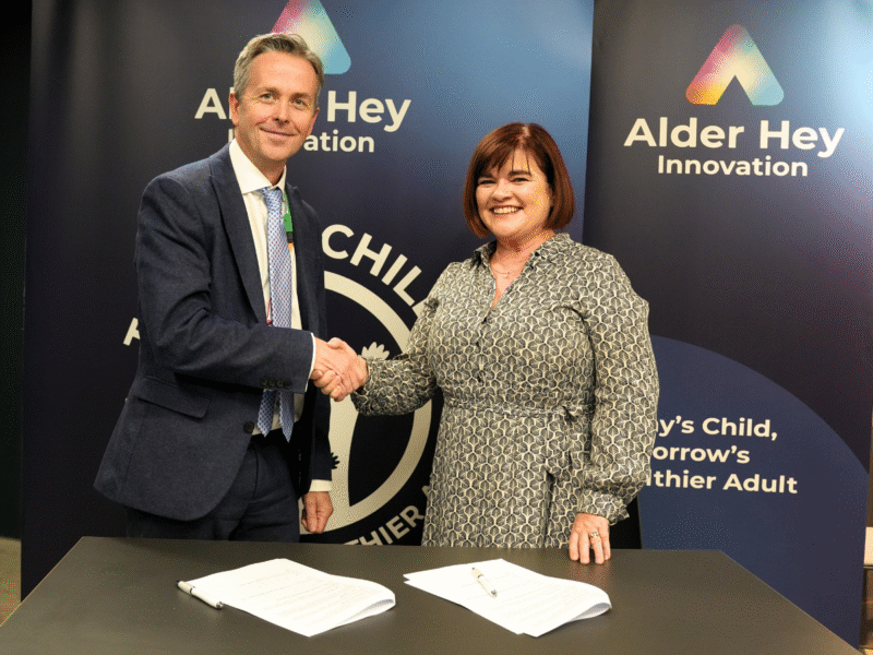 CEO of Alder Hey and Children's Health Ireland shaking hands after signing a Memorandum of Understanding.