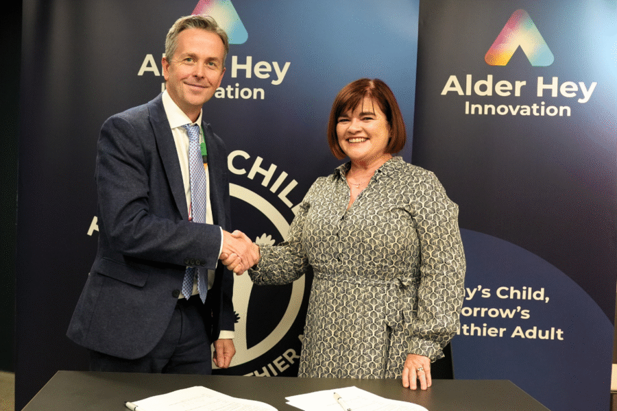 CEO of Alder Hey and Children's Health Ireland shaking hands after signing a Memorandum of Understanding.
