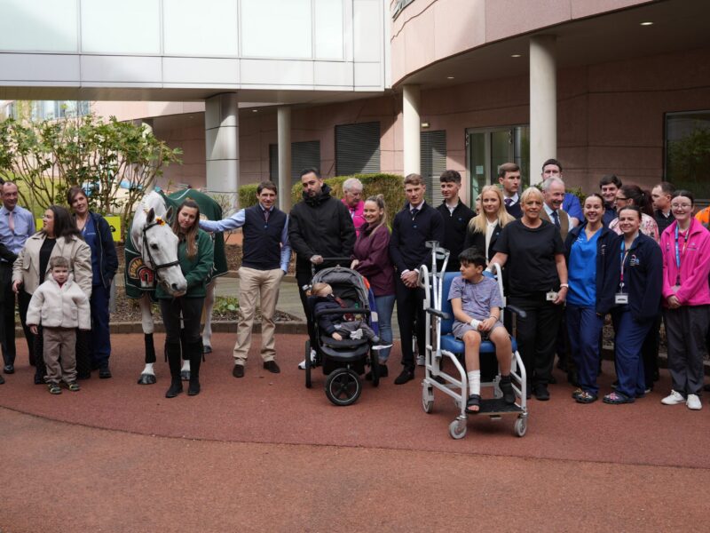 Group shot of the Neptune, staff, jockeys and children