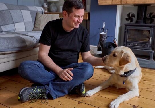 Nathan pictured with trainee guide dog