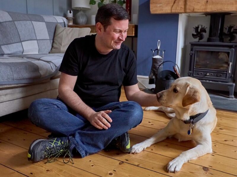 Nathan pictured with trainee guide dog