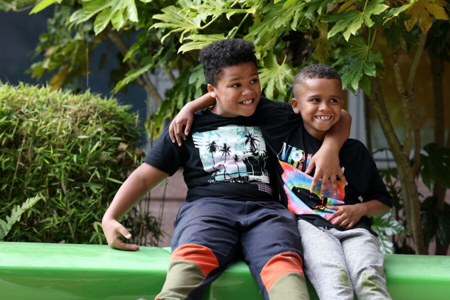 Two children with arms around each other