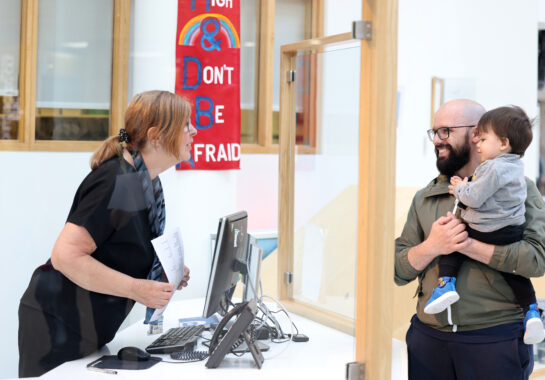 Parent talking to receptionist