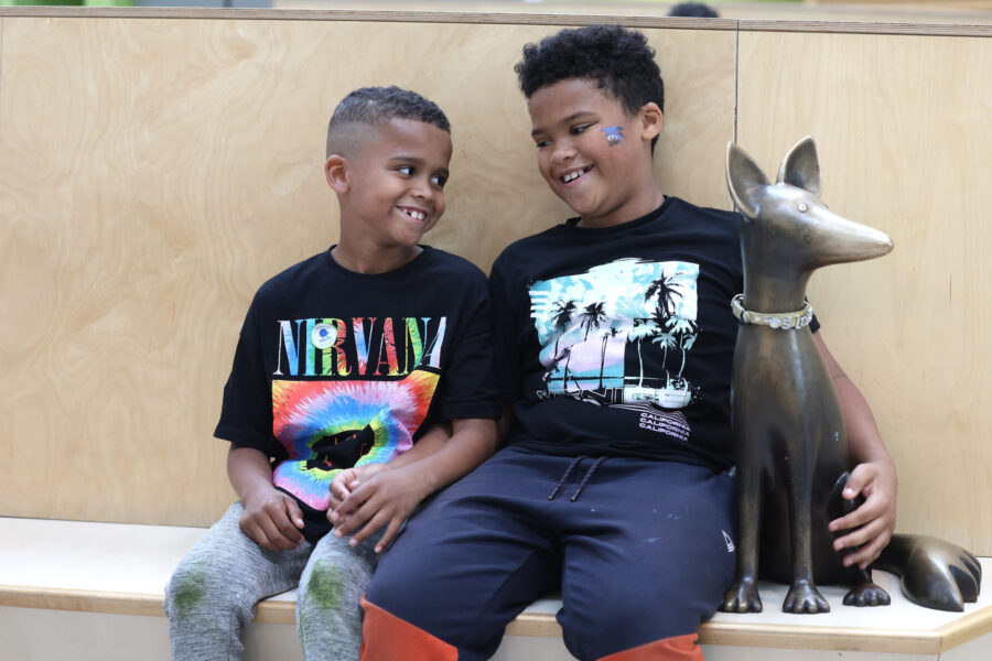 Two boys in atrium next to Sloane
