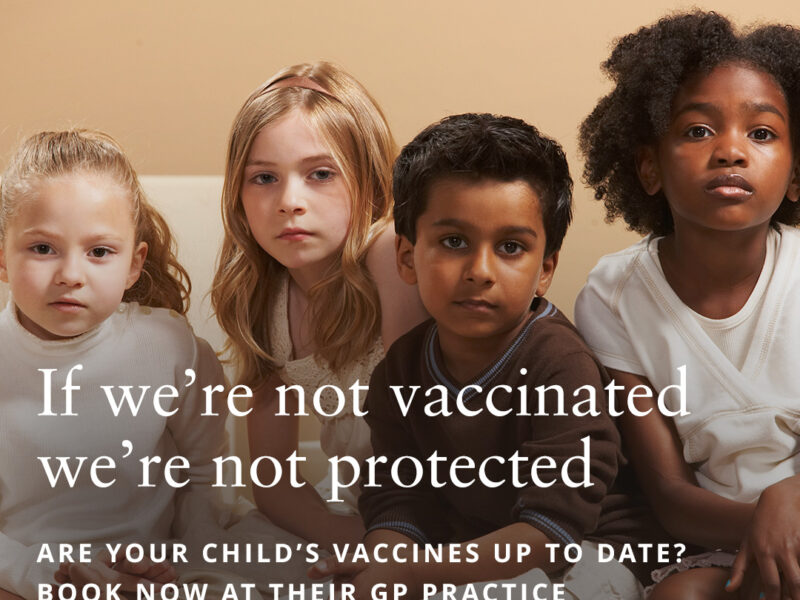 children posing for image about vaccines